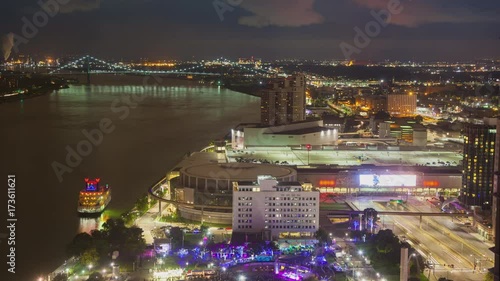 Detroit MI City Riverfront Timelapse at Night with Moving Vehicle and Boat Traffic in a Vibrant Evening Exterior Light Scene  photo