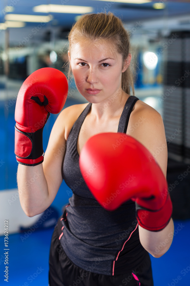 Woman boxing in gym
