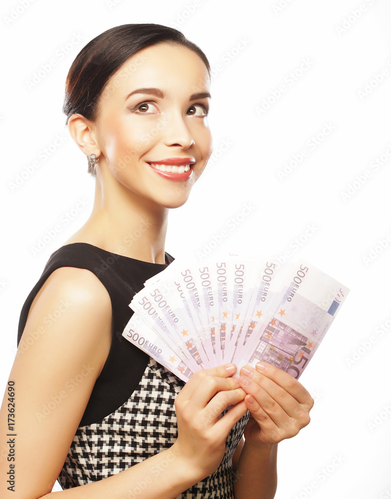 Young happy woman with dollars in hand. Isolated on white backgr Young happy woman with dollars in hand. Isolated on white backgr