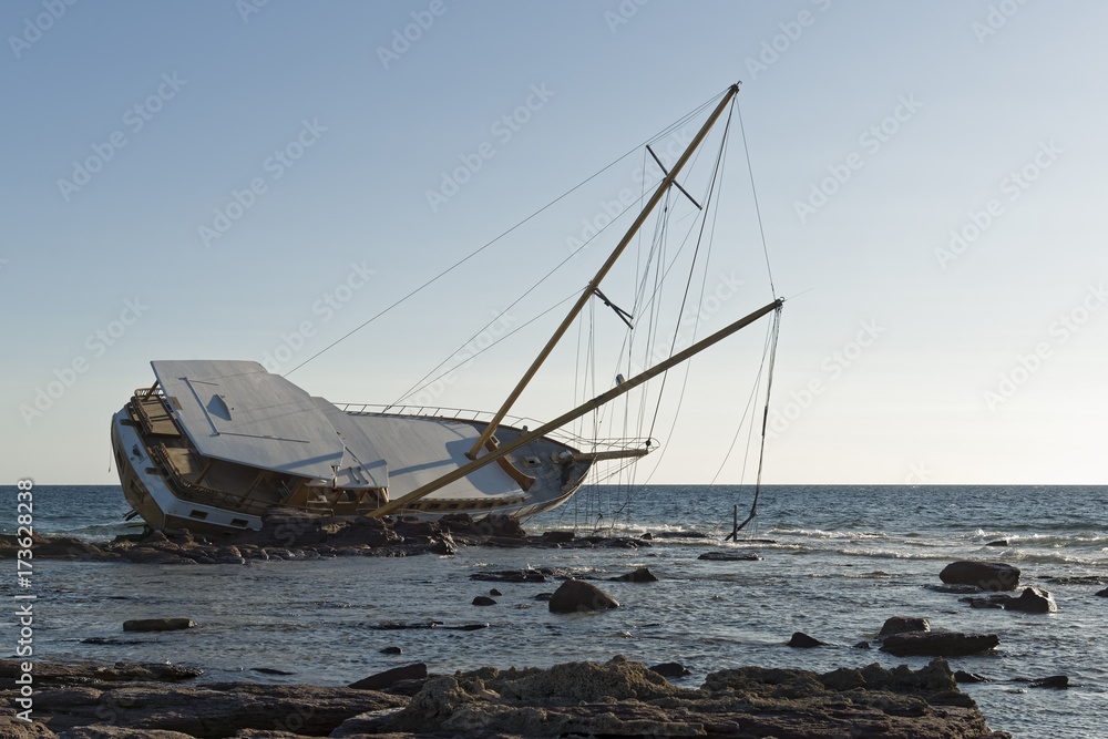 Sailing ship stranded on the rocks Sailing ship stranded on the rocks
