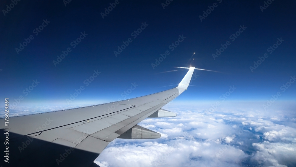 Fototapeta premium view from the airplane window, ocean blue