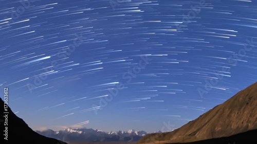 Traces from stars in the form of evanescent traces. Moon rise. Plateau Kara-Say (3.800 m.) Kyrgyzstan. Time Lapse photo