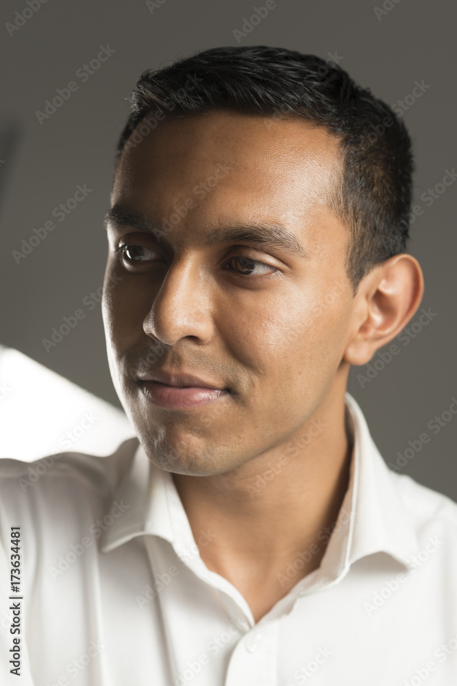Closeup Portrait of Man in Collared White Shirt Looking Away Closeup Portrait of Man in Collared White Shirt Looking Away