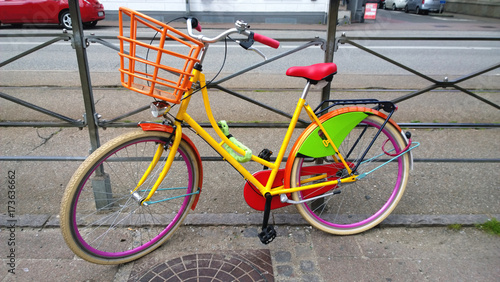 Photography Brightly colored bike parked on the street