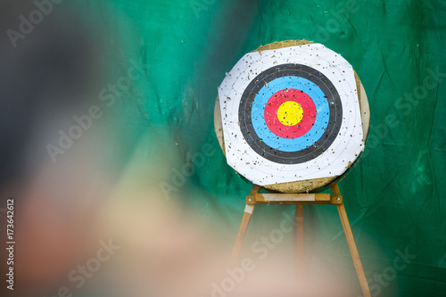 Archery target ring and an archer with a bow photo