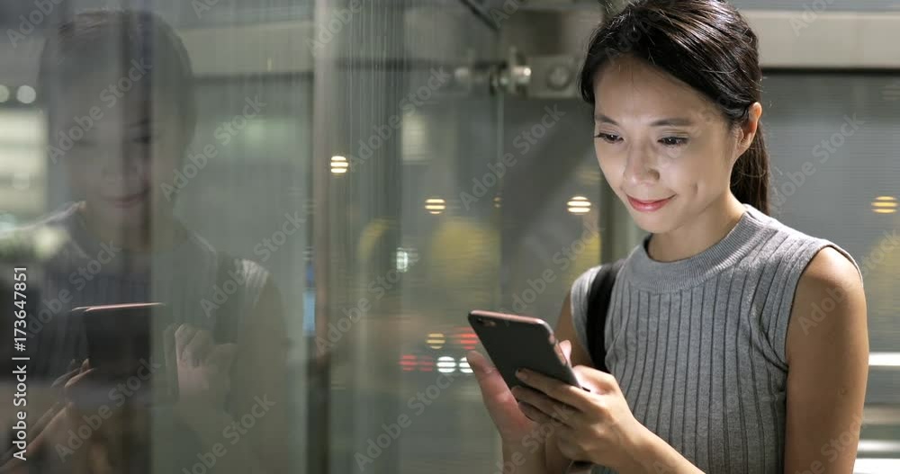 Woman using smart phone in evening Woman using smart phone in evening