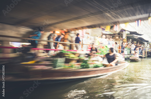 Blur motion of thai boat and floating market in Thailand