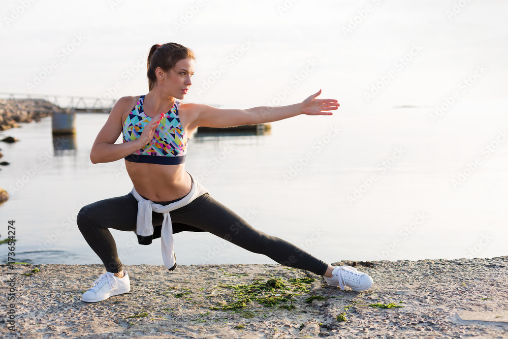 Woman working out on the beach