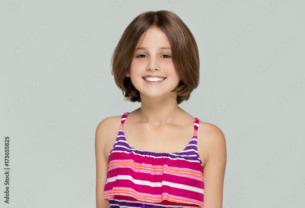 Young girl posing in fashionable dress. Young girl posing in fashionable dress.