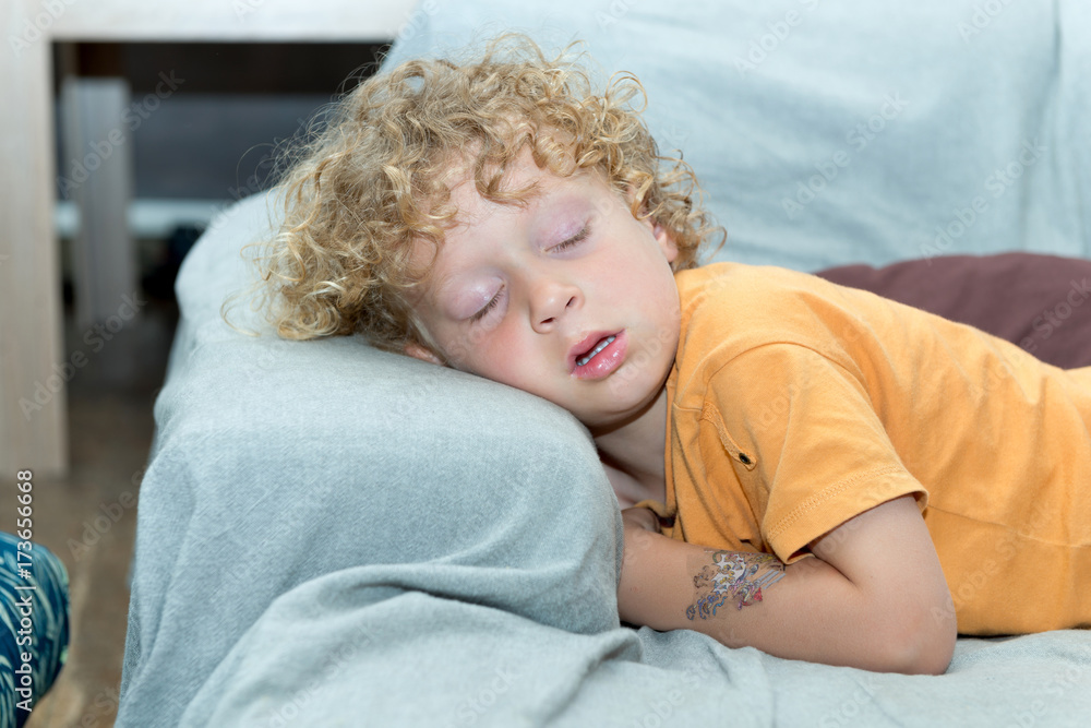 little boy sleeping on the sofa little boy sleeping on the sofa