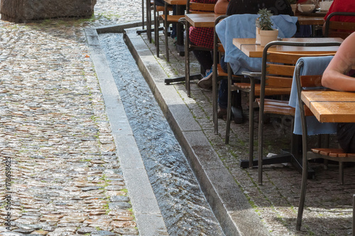Small water canals in the streets in Freiburg photo