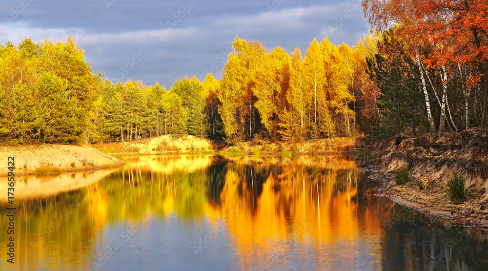 bright, rich colors of autumn foliage reflected in the lake bright, rich colors of autumn foliage reflected in the lake