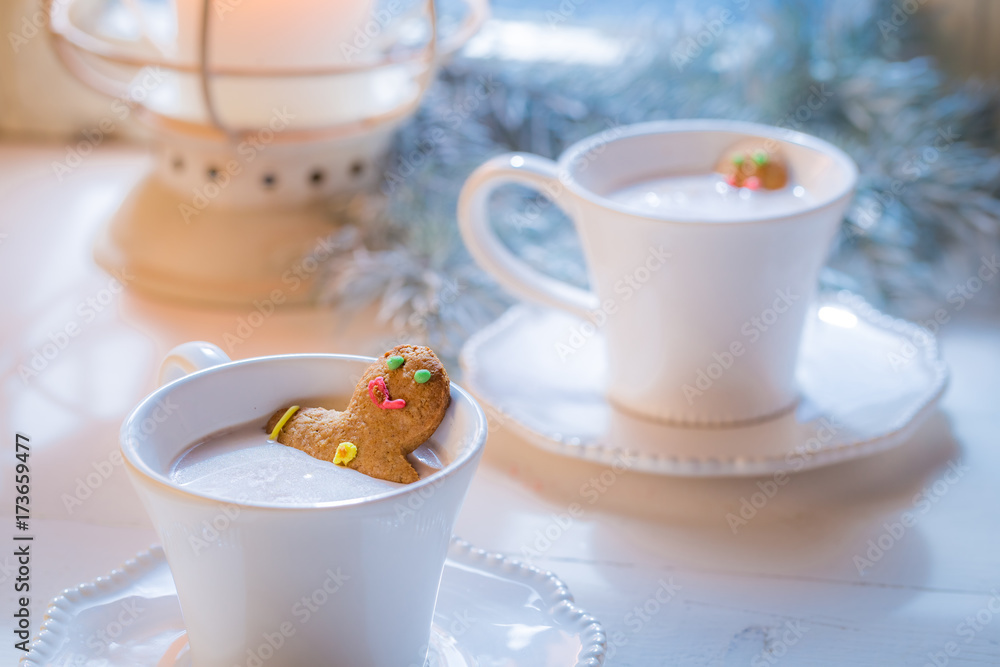 Homemade two gingerbread man in hot chocolate for Christmas Homemade two gingerbread man in hot chocolate for Christmas