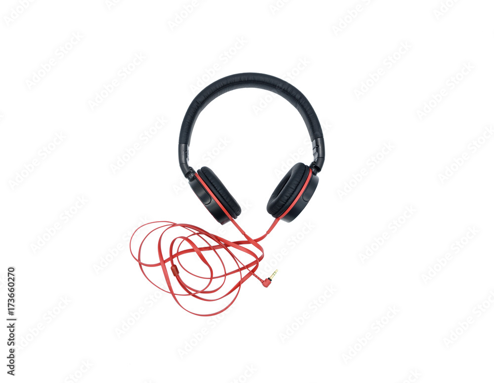 Fototapeta premium Black headphones hanging on a white background with a red wire