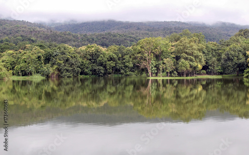 Lake with forest reflection wave and The mountain.