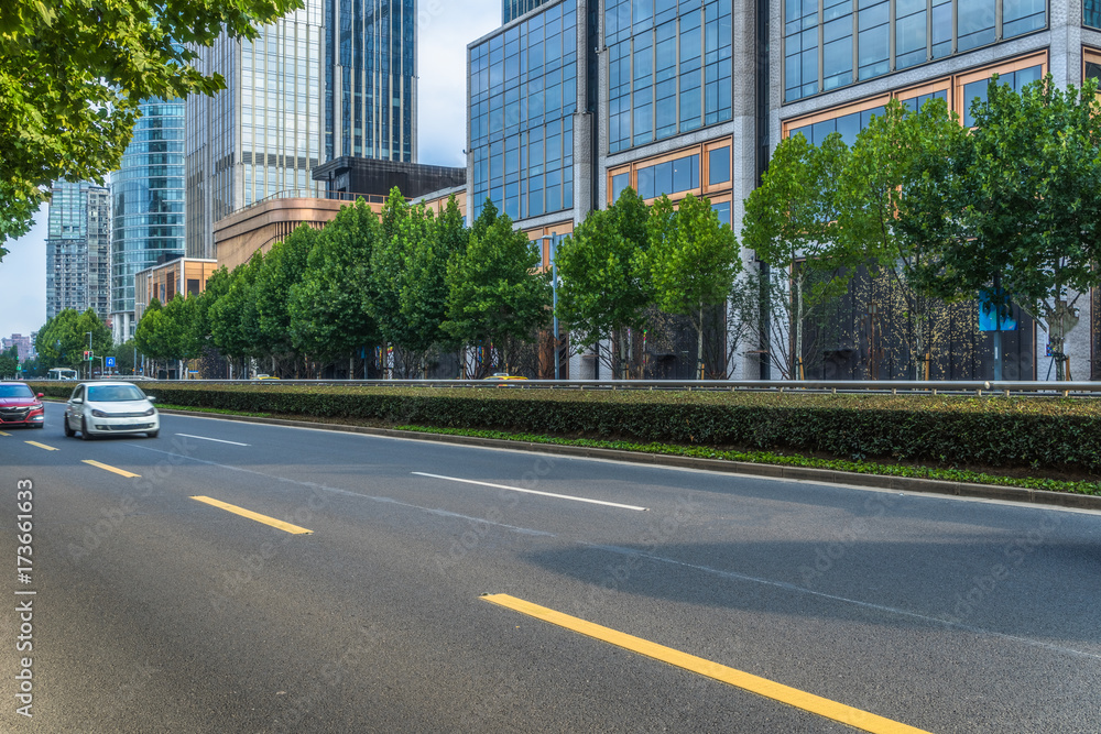 empty asphalt road front of modern buildings.