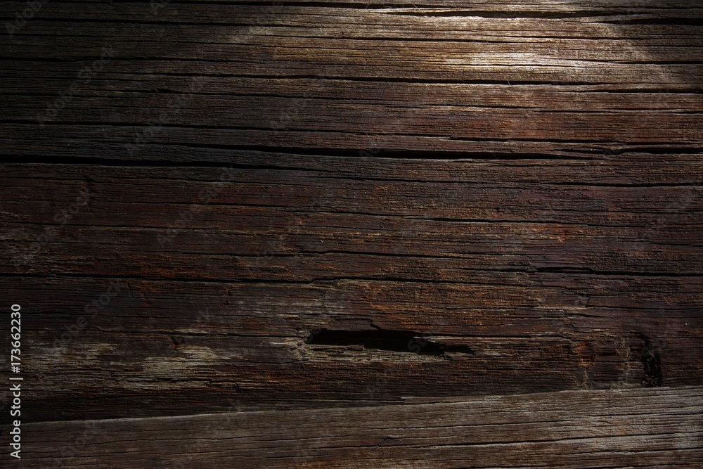 Naklejka premium Dark wooden background