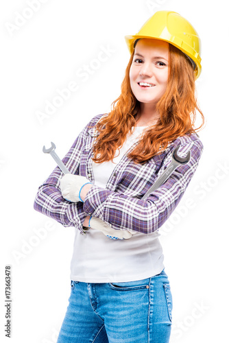 portrait of a woman in a helmet with mechanic keys on a white background