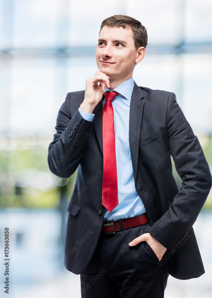 Thoughtful smiling boss in business suit in office Thoughtful smiling boss in business suit in office