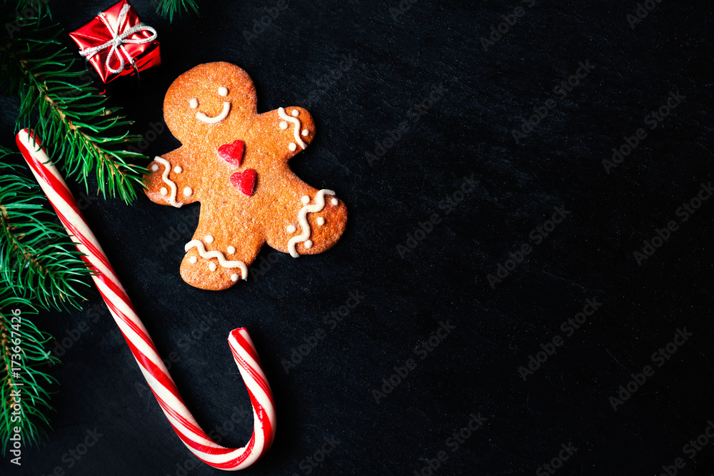 Christmas composition with Christmas gift, gingerbread man cookie, fir tree branches, Christmas composition with Christmas gift, gingerbread man cookie, fir tree branches,