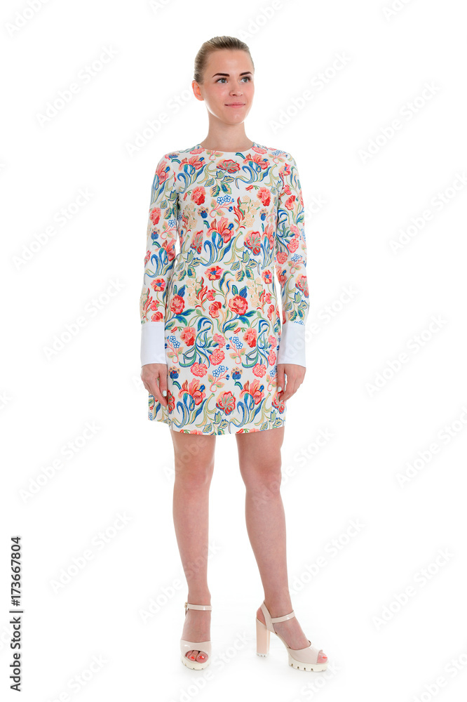 Young elegant female in light summer dress, over white background