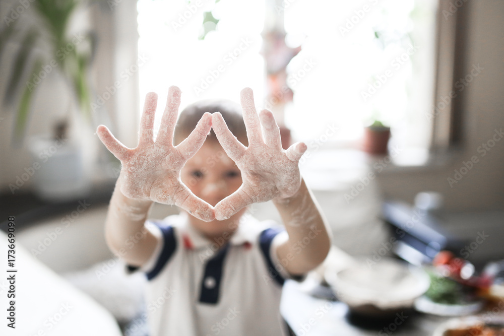 blond caucasian boy with flour in real interior blond caucasian boy with flour in real interior