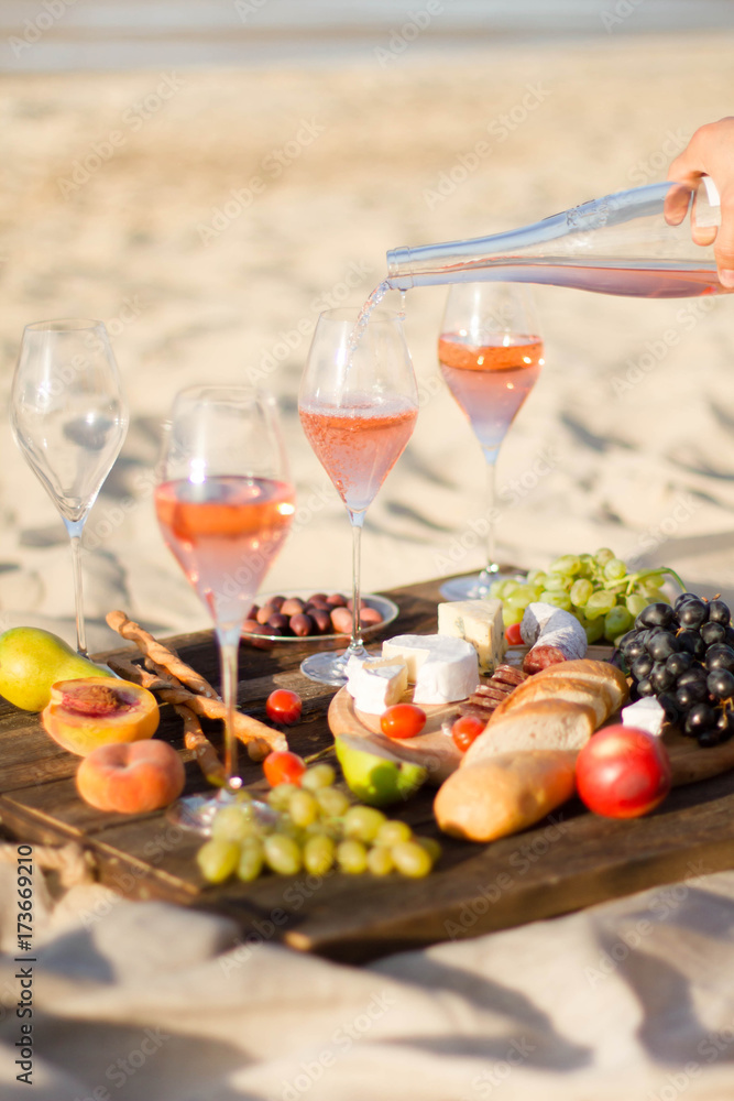 Refreshing Rosa Wine in a Glass . Beach Cheers Celebration Friendship Summer Fun Dinner Concept.