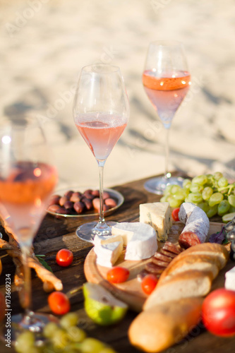 Refreshing  Rosa Wine in a Glass . Beach Cheers Celebration Friendship Summer Fun Dinner Concept.