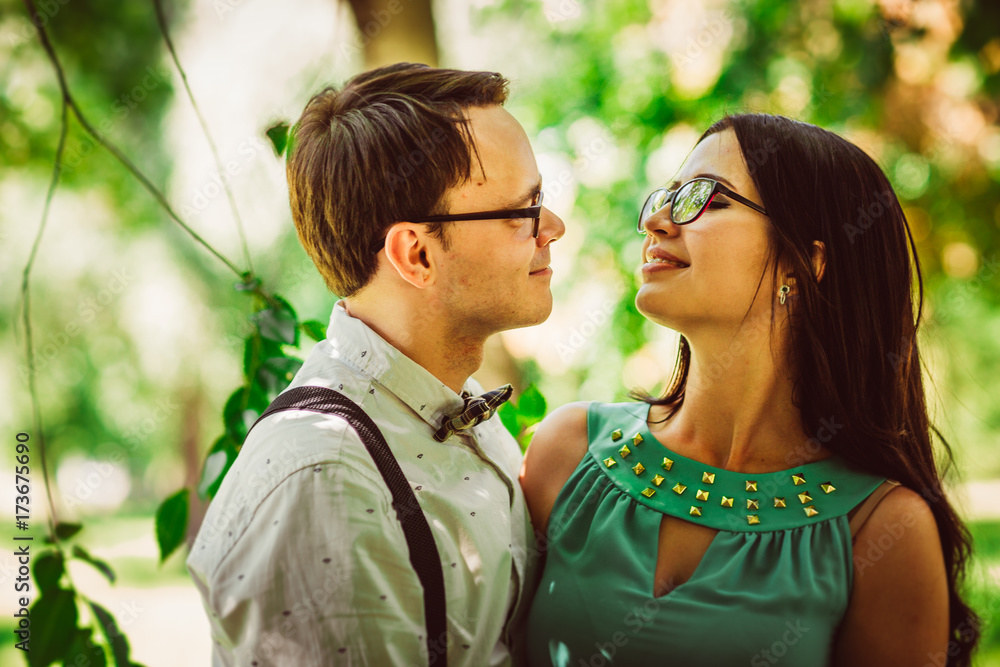 Fototapeta premium Beautiful young couple on the park background