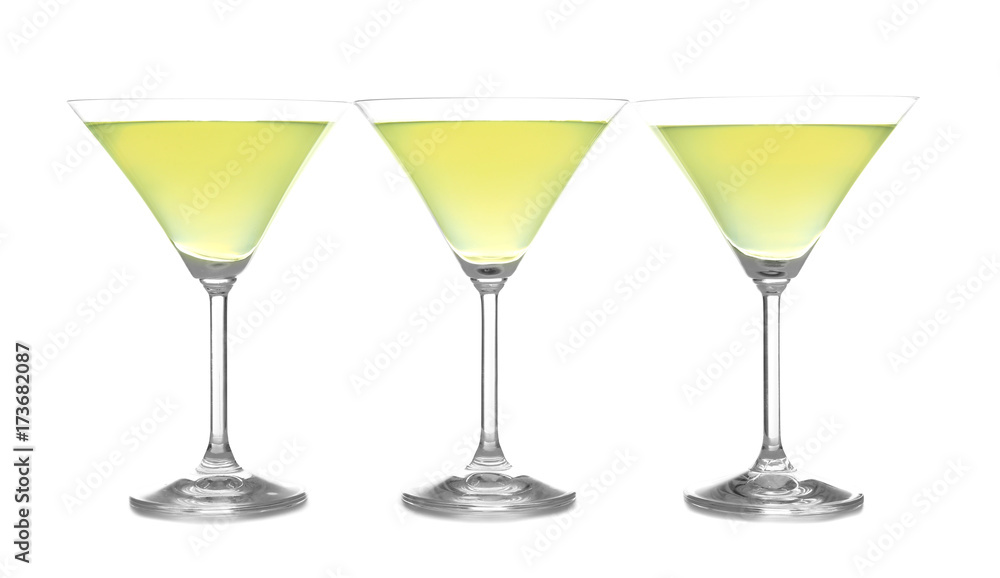 Glasses of lemon drop martini on white background Glasses of lemon drop martini on white background