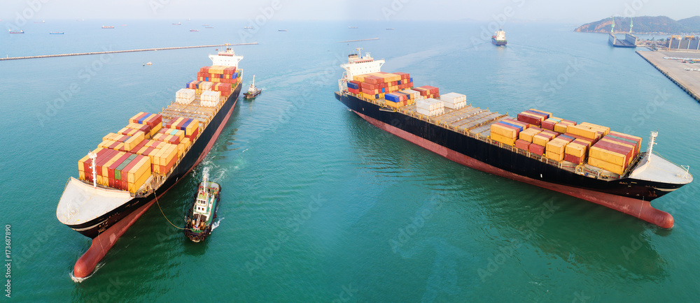 two containers ship arrival toz the international sea port for loading discharging containers of global logistics worldwide services, transmission transport, maritime commercial