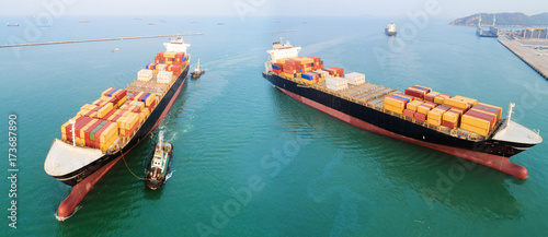 two containers ship arrival toz the international sea port for loading discharging containers of global logistics worldwide services, transmission transport, maritime commercial photo