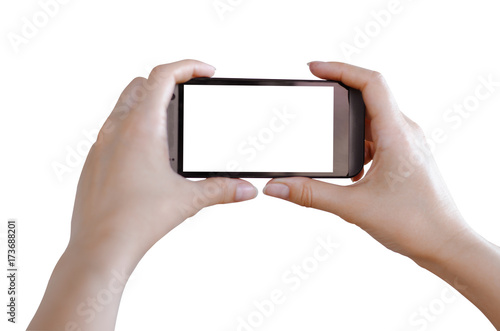 Female hands holding a phone isolated on white.