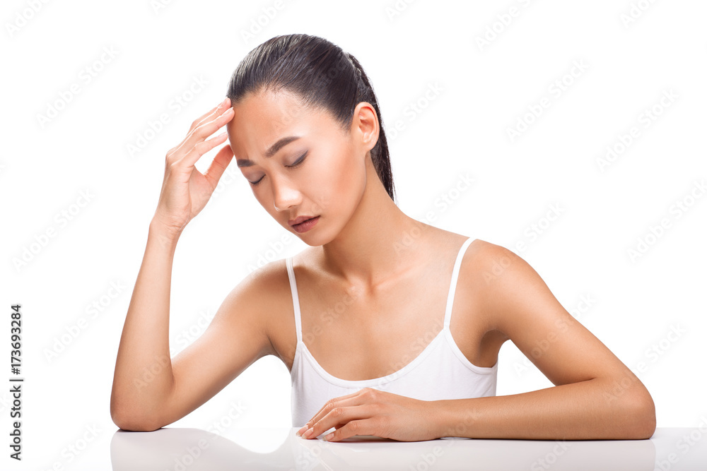 Young Asian woman having headache isolated on white background Young Asian woman having headache isolated on white background