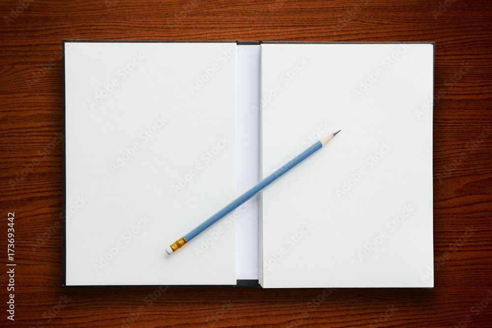 open notebook with pencil open notebook with pencil