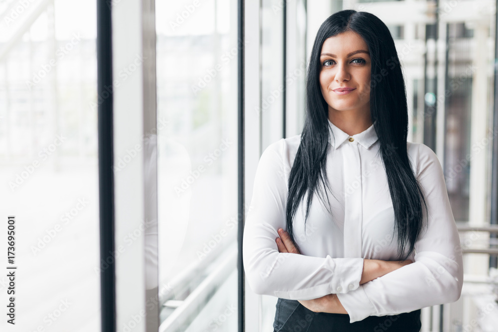 Fototapeta premium Successful confident business woman in an office setting
