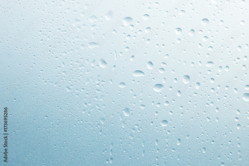 Light rain on the window glass, grainy texture on background Light rain on the window glass, grainy texture on background