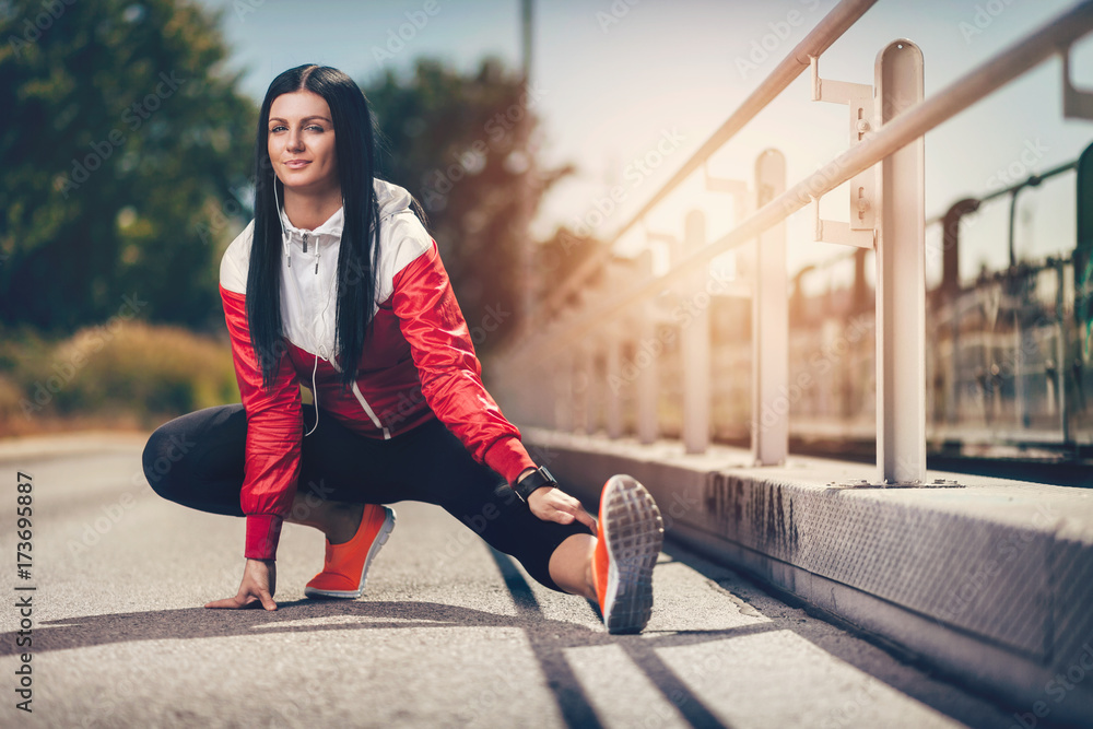 City workout. Beautiful woman training in an urban setting City workout. Beautiful woman training in an urban setting