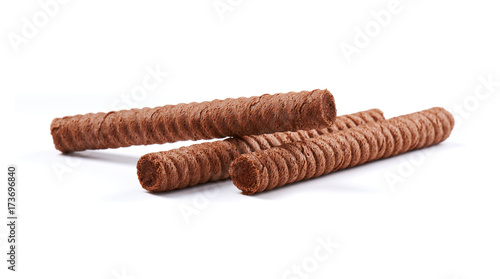 Chocolate wafer rolls with butter and cocoa filling on a white background