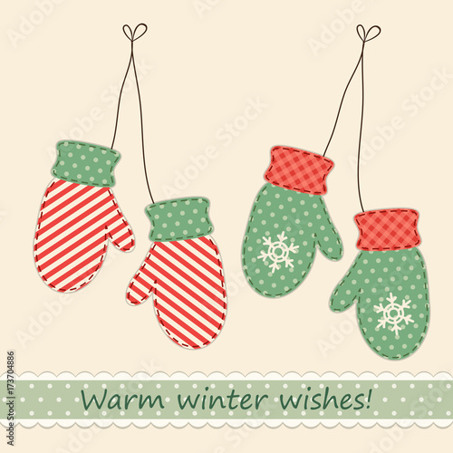 Cute fabric retro mittens as Christmas decorations in shabby chic style