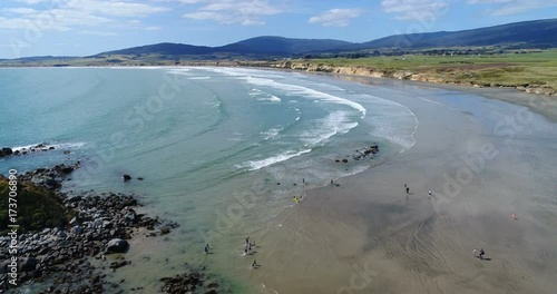 New Zealand aerial drone footage of coast and beach nature landscape at Te Waewae Bay by Orepuki in the Southland region of the south island of New Zealand. photo