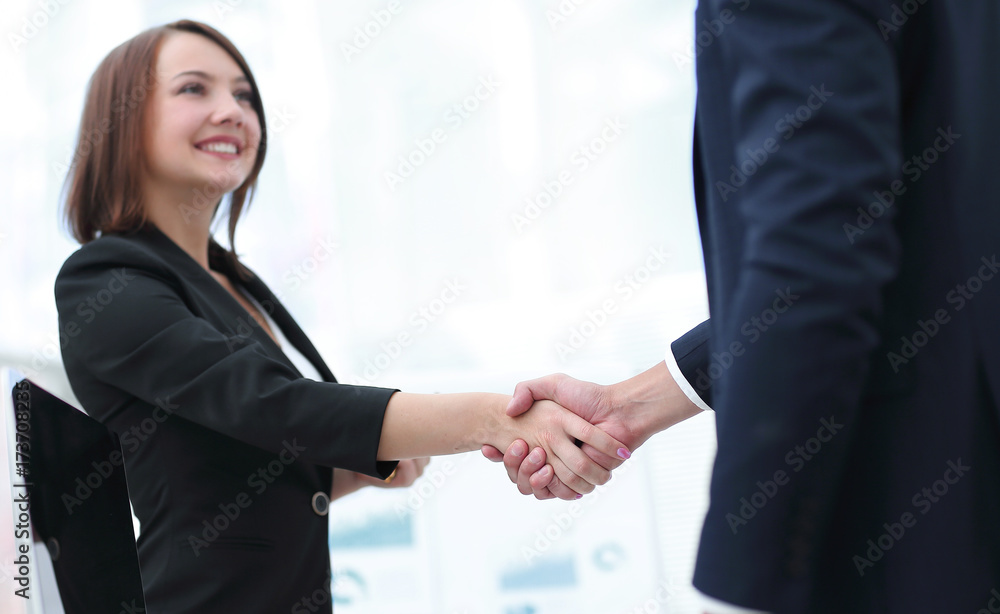 business colleagues shaking hands after a successful presentation. business colleagues shaking hands after a successful presentation.
