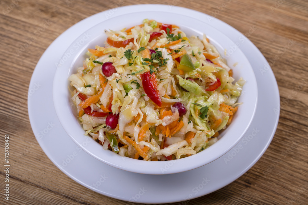 Ukrainian and Russian dishes - homemade marinated, sour cabbage with carrots and onions, close up
