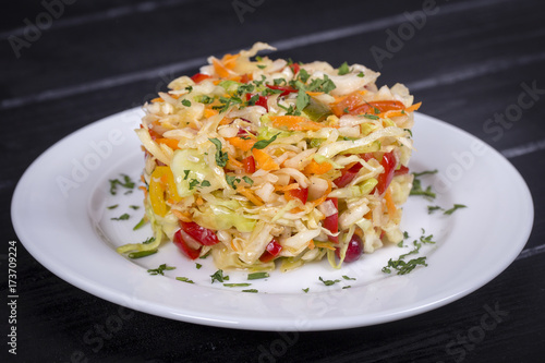 Ukrainian and Russian dishes - homemade marinated, sour cabbage with carrots and onions, close up