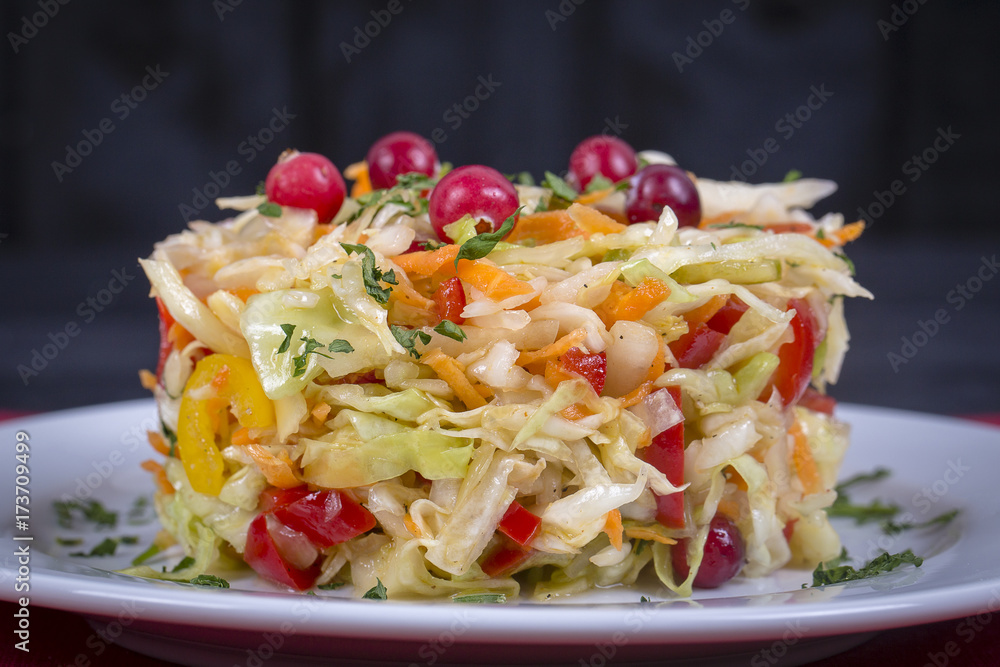 Ukrainian and Russian dishes - homemade marinated, sour cabbage with carrots and onions, close up Ukrainian and Russian dishes - homemade marinated, sour cabbage with carrots and onions, close up