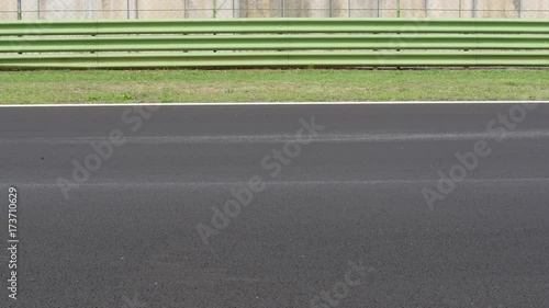 Wallpaper Mural Motorsport circuit track straight line with blurred car racing crossing left to right Torontodigital.ca