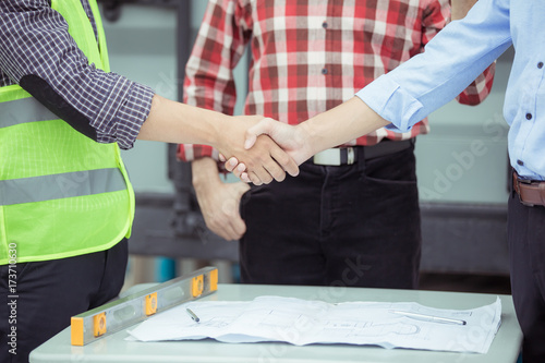 Team Business Partners Giving Fist Bump to Greeting Start up project with Contractor. Corporate Teamwork Partnership in an Office Meeting. Man with Hands together. Industry Business Concept.