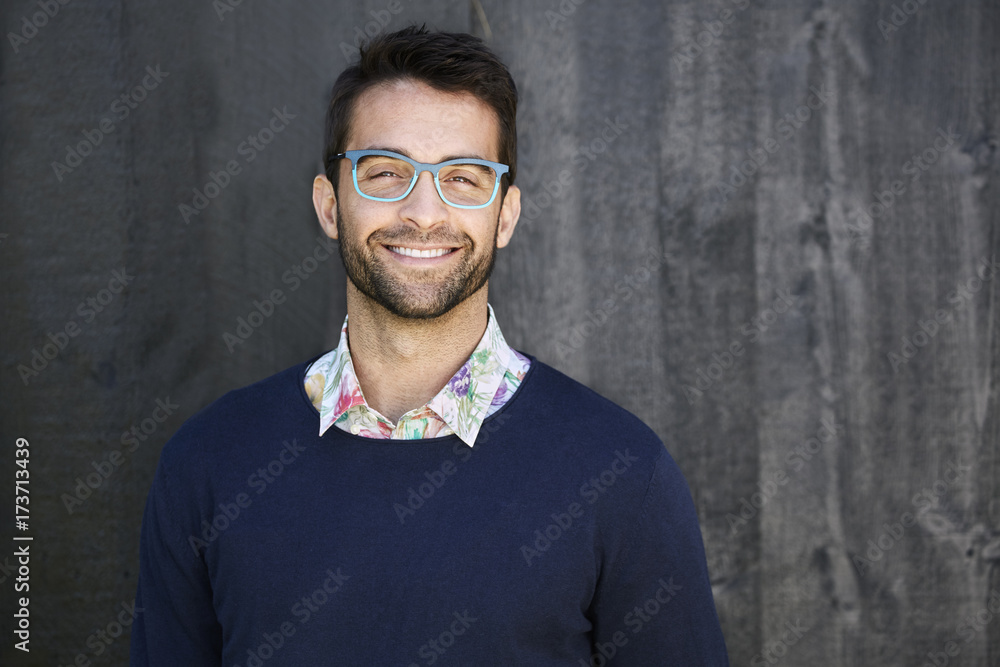 Portrait of smiling dude in glasses and sweater Portrait of smiling dude in glasses and sweater