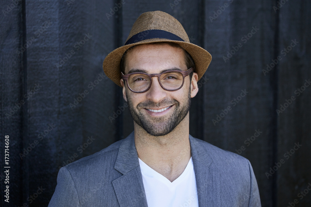 Smiling guy in hat and glasses, portrait Smiling guy in hat and glasses, portrait