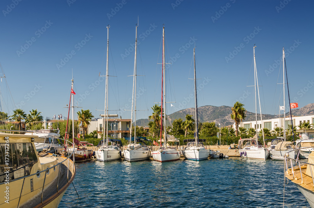 Sunny view of boats at Ortakent near Bodrum, Mugla, Turkey.